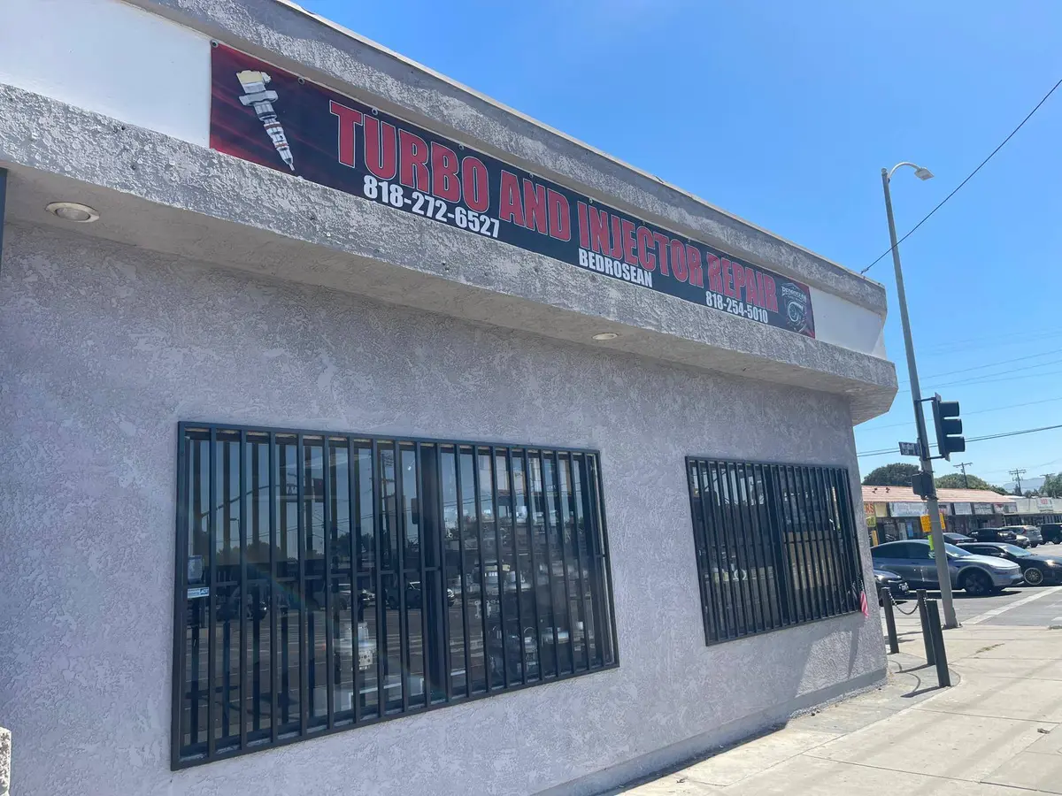Bedrosean Repair storefront on Nordhoff St in North Hills, with the turbo and injector repair banner and both phone numbers