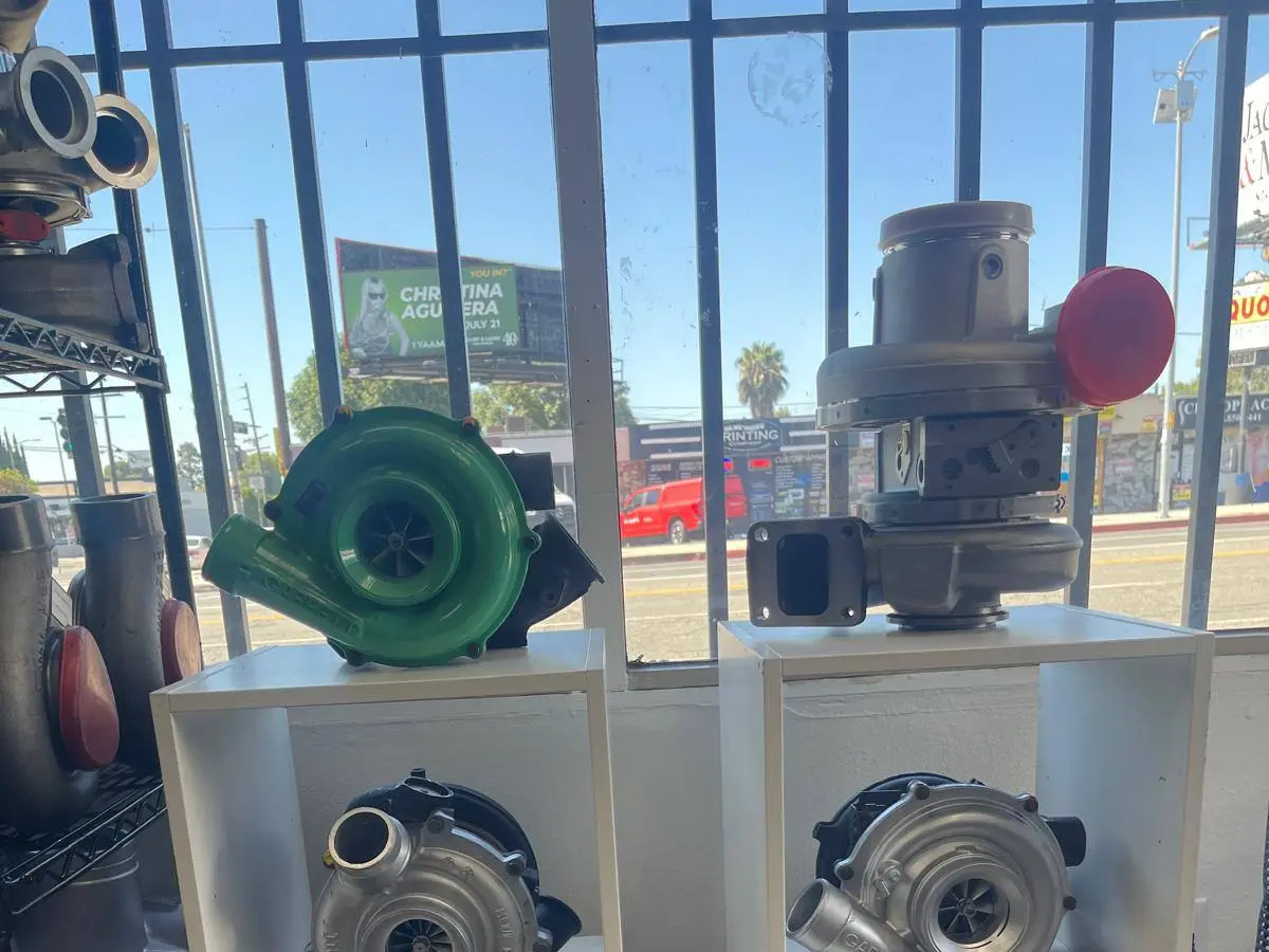 Finished rebuilt turbochargers on display in the shop window, including Garrett units