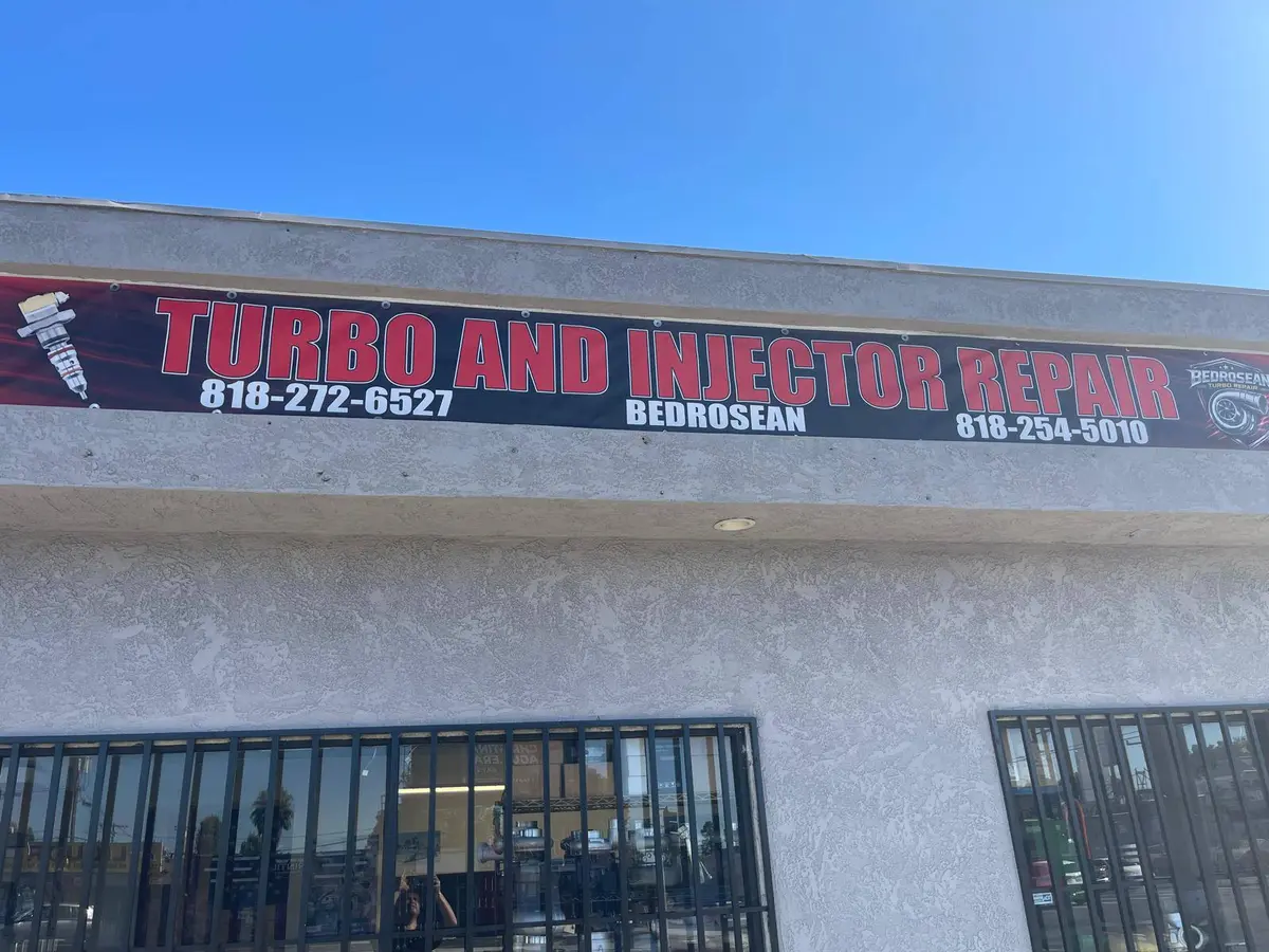 The Turbo and Injector Repair banner above the shop entrance, with the Bedrosean shield logo and both phone numbers